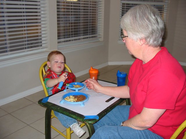 Eating at the little table and chair